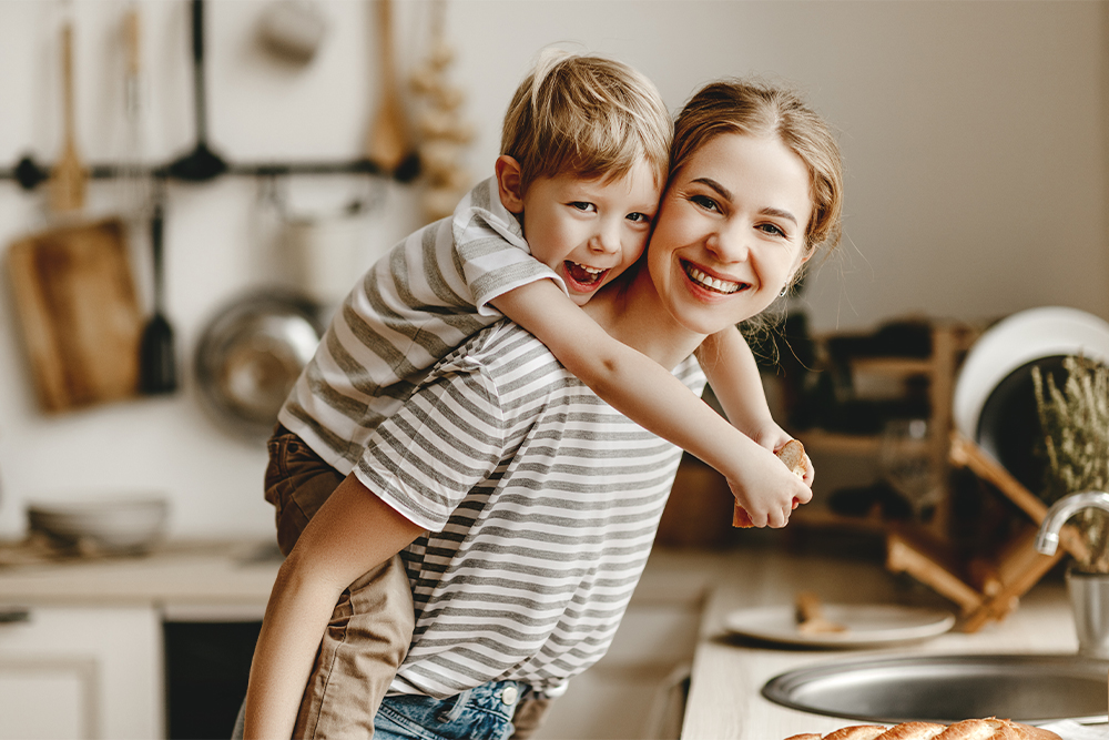 Girl carries brother on her back
