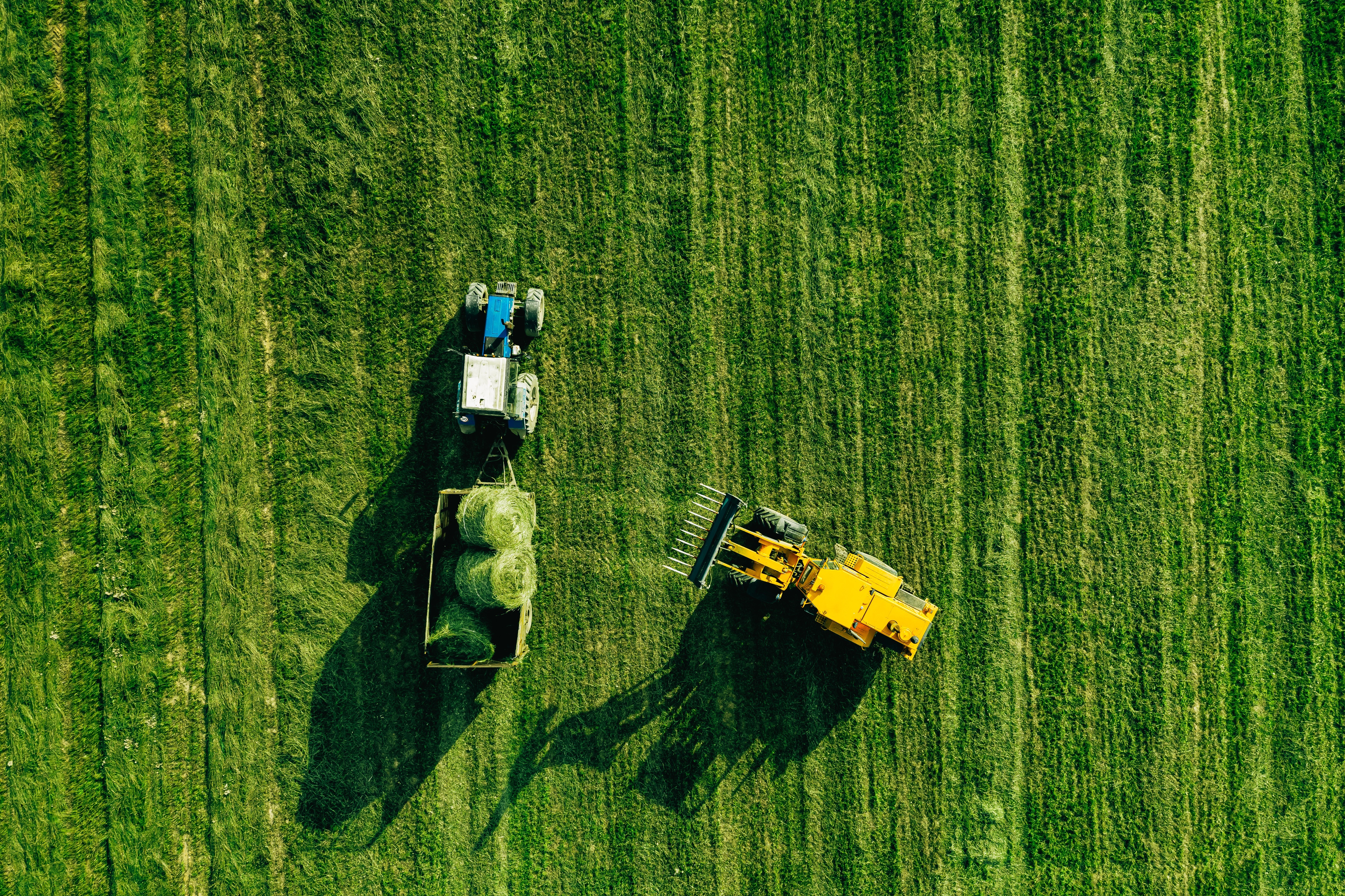 tractor and agricultural machinery in a field